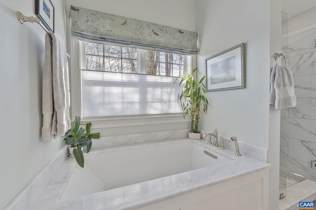 bathroom with a garden tub