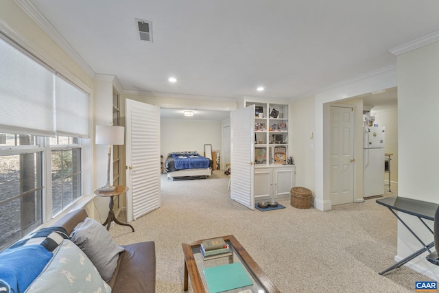 carpeted bedroom with visible vents, baseboards, ornamental molding, recessed lighting, and freestanding refrigerator