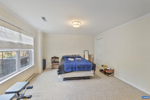 carpeted bedroom with visible vents, a baseboard heating unit, crown molding, and baseboards