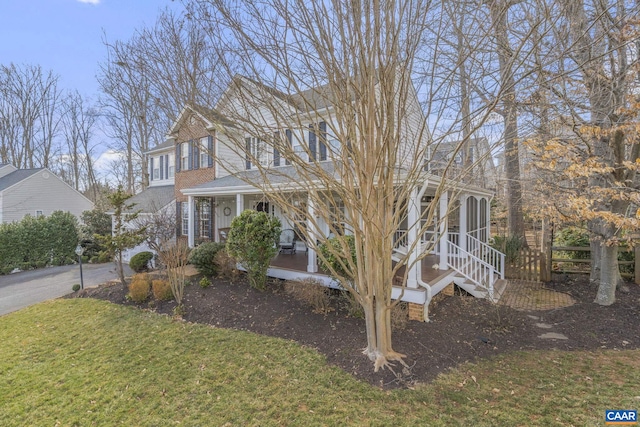 view of front of home featuring a porch and a front yard