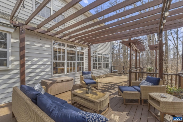 wooden terrace featuring an outdoor living space and a pergola