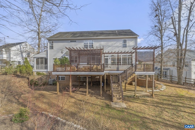 back of property featuring stairway, a wooden deck, a lawn, cooling unit, and a pergola