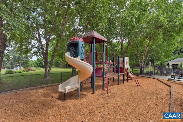 community jungle gym featuring fence