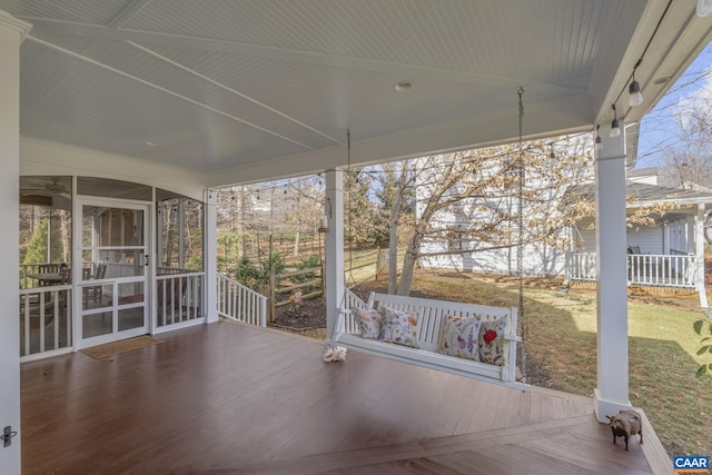 view of patio / terrace with a sunroom