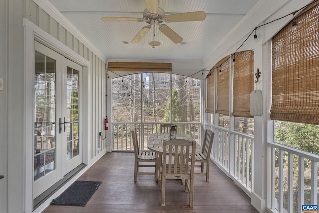 sunroom featuring french doors and ceiling fan