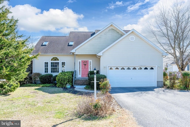 view of front of home with a garage, a front lawn, driveway, and a shingled roof