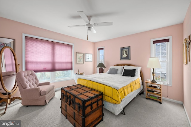 carpeted bedroom featuring a ceiling fan and baseboards