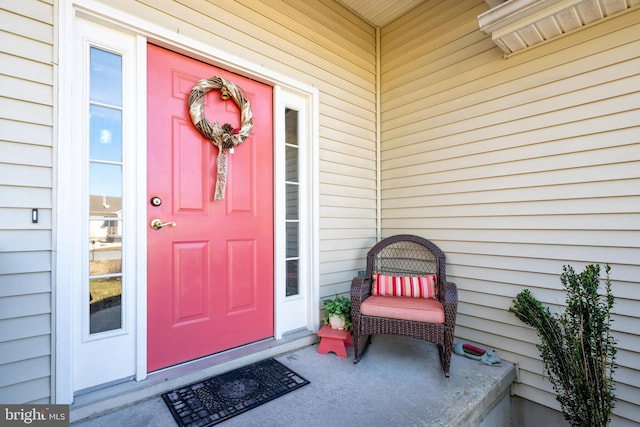 view of exterior entry featuring a porch