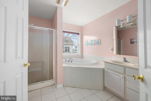 bathroom featuring vanity, visible vents, a stall shower, tile patterned flooring, and a bath