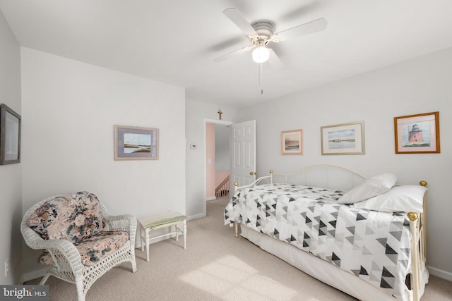 bedroom with carpet flooring, baseboards, and ceiling fan