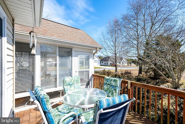 deck with outdoor dining area