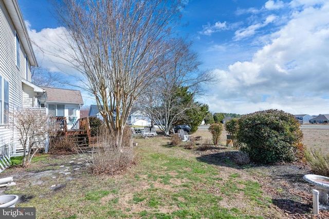 view of yard with a deck