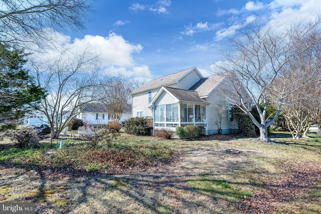 view of home's exterior featuring a sunroom