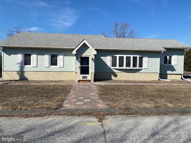 view of front of house with roof with shingles