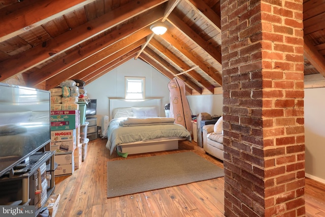 unfurnished bedroom with wood ceiling, vaulted ceiling with beams, and hardwood / wood-style flooring