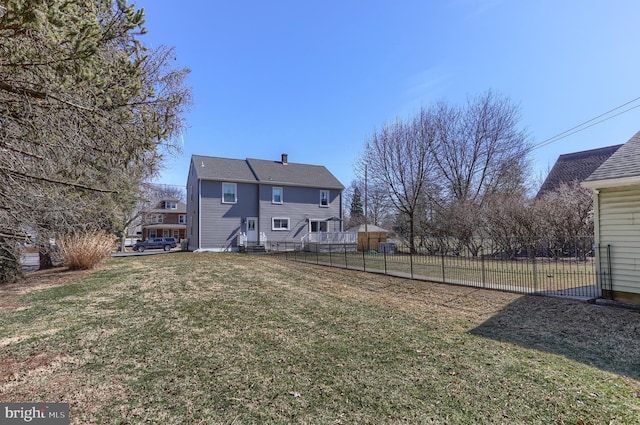 view of yard with entry steps and fence