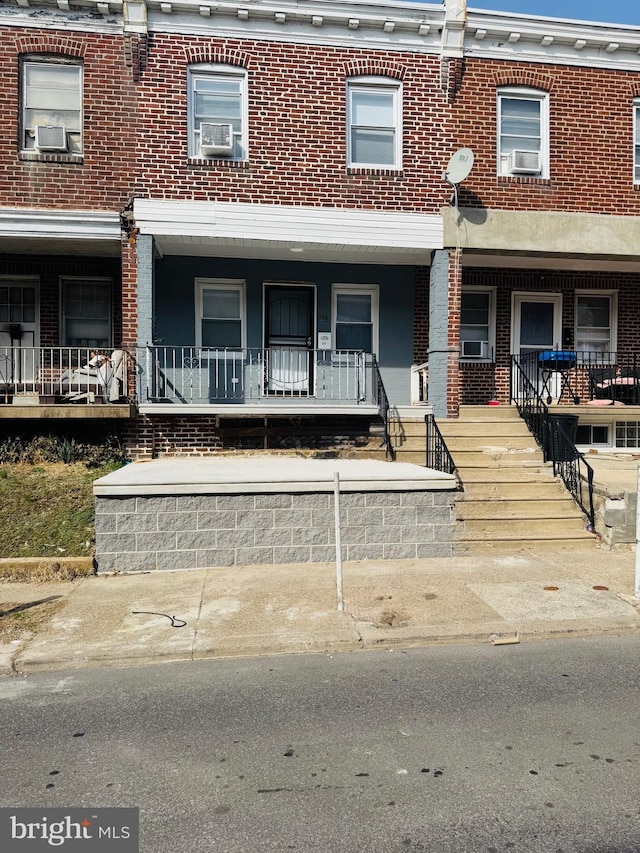 531 E Luray St, Philadelphia, PA 19120 - townhome / multi-family property featuring a porch, cooling unit, and brick siding