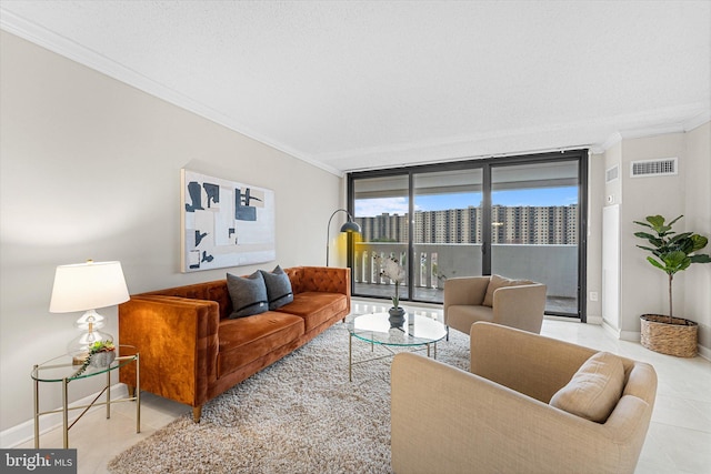 tiled living area with visible vents, a view of city, baseboards, and ornamental molding