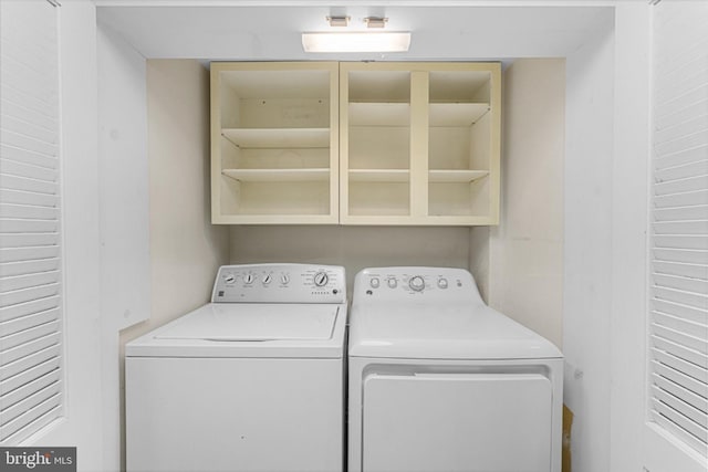 laundry area with laundry area and washer and clothes dryer