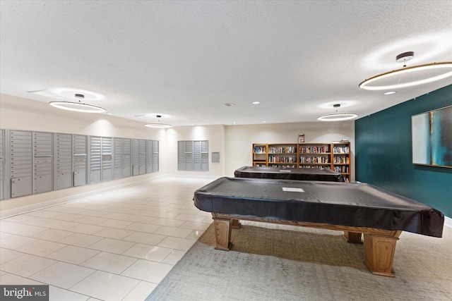 recreation room featuring tile patterned flooring, pool table, baseboards, mail area, and a textured ceiling