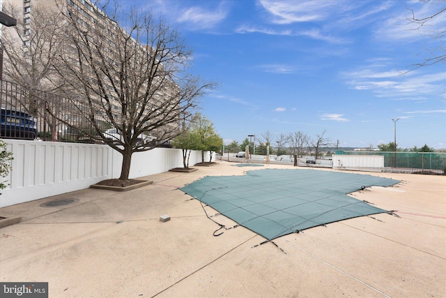 view of pool featuring a patio, fence, and a fenced in pool