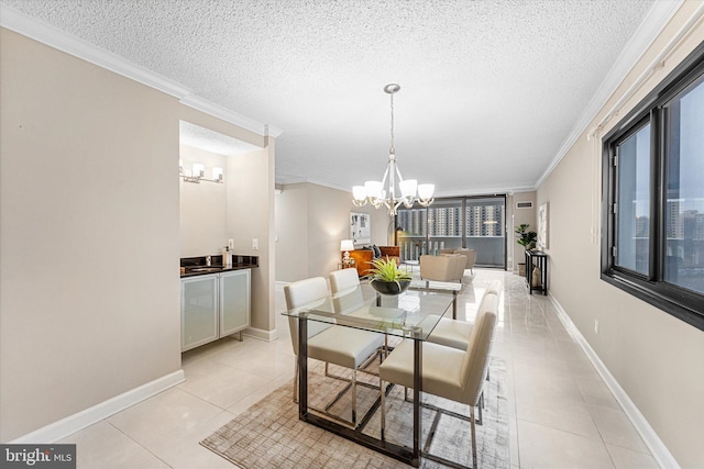 dining area with light tile patterned floors, a notable chandelier, and crown molding