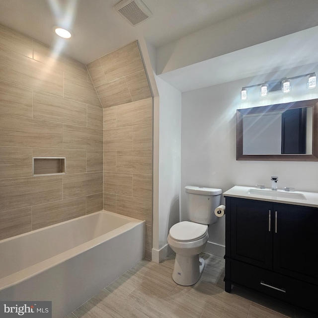 bathroom featuring visible vents, toilet, shower / bathtub combination, baseboards, and vanity