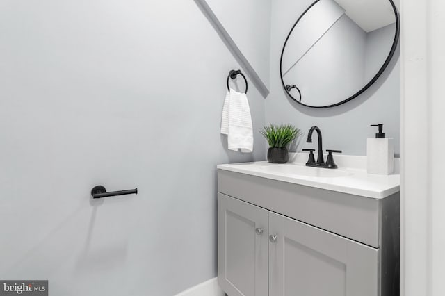 bathroom with vanity and baseboards