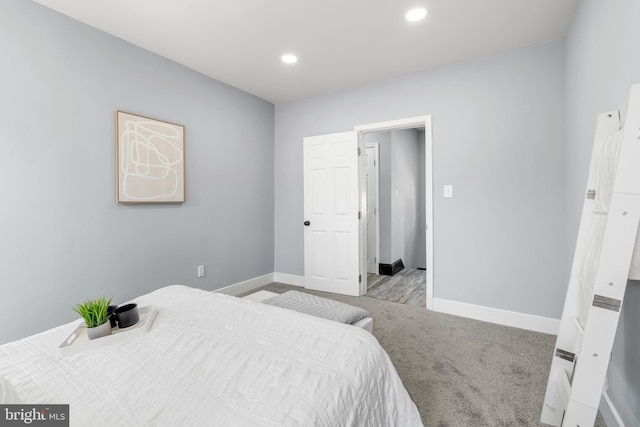 bedroom with recessed lighting, baseboards, and carpet floors