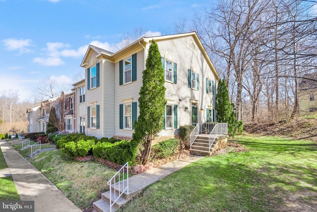 view of home's exterior featuring a lawn