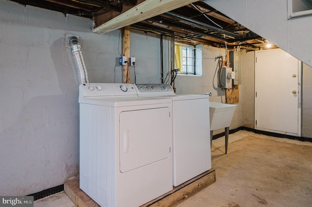 clothes washing area featuring laundry area and washing machine and clothes dryer