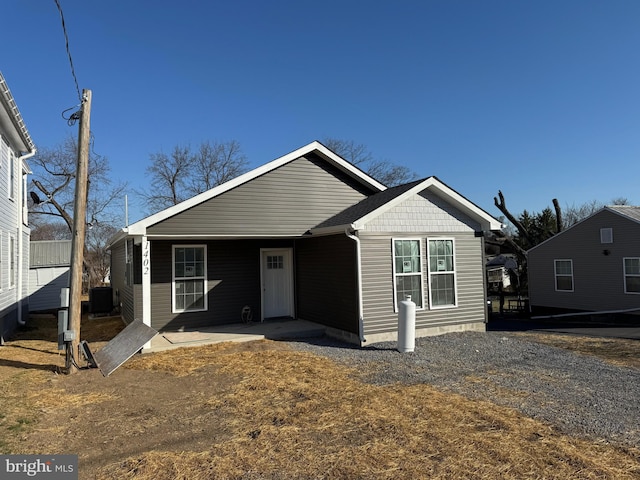 view of front of home featuring central air condition unit and a patio