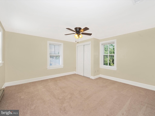 unfurnished bedroom with visible vents, baseboards, carpet floors, a closet, and a ceiling fan