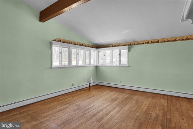 empty room featuring a baseboard radiator, wood-type flooring, baseboard heating, and vaulted ceiling with beams