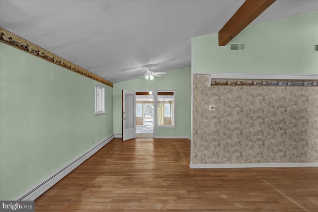 unfurnished room featuring visible vents, lofted ceiling with beams, wood finished floors, baseboard heating, and ceiling fan