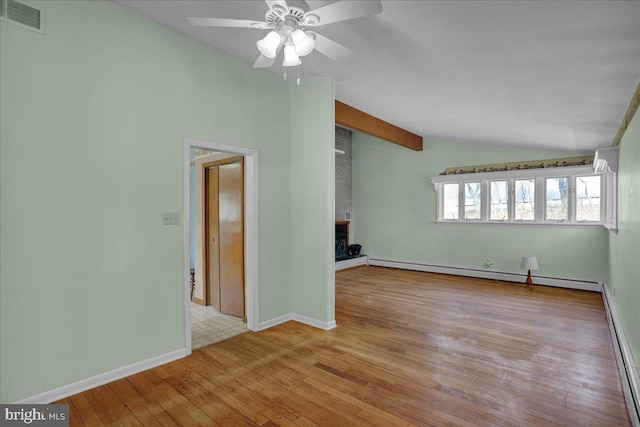 unfurnished living room with visible vents, vaulted ceiling with beams, a fireplace, a baseboard heating unit, and baseboard heating