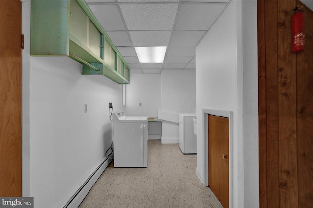 washroom featuring laundry area, washer / clothes dryer, baseboards, and a baseboard radiator