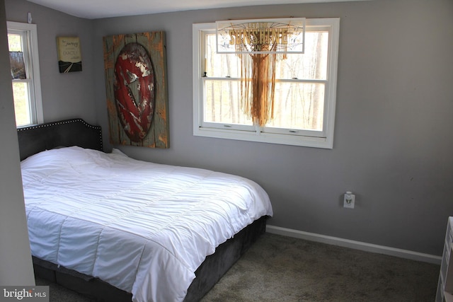 carpeted bedroom with baseboards