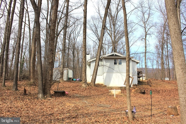 view of side of property with a chimney