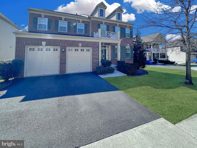 view of front of home with a front yard, a balcony, a garage, aphalt driveway, and brick siding