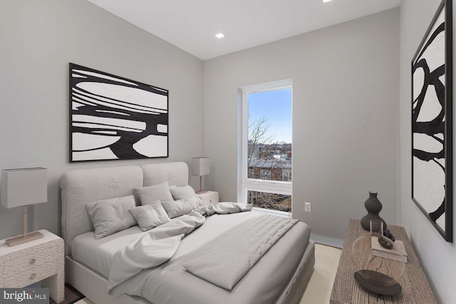 bedroom featuring recessed lighting and baseboards