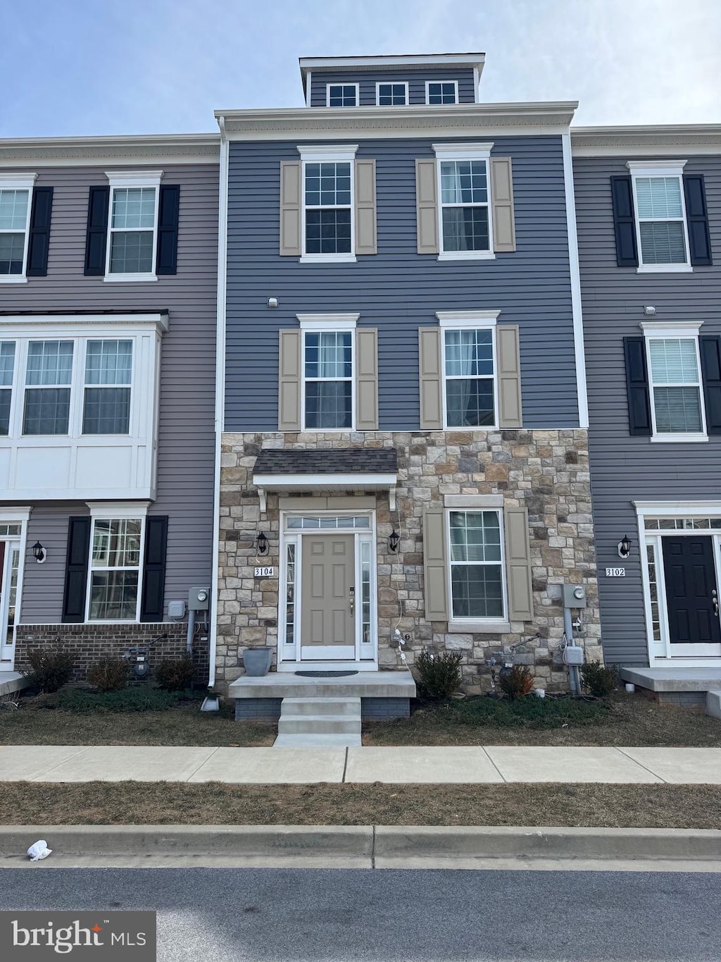 multi unit property featuring stone siding