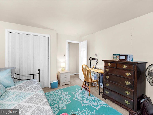 carpeted bedroom with a closet