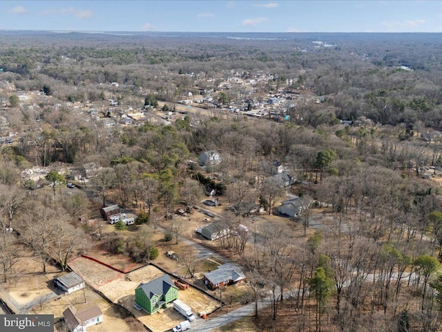 aerial view featuring a wooded view