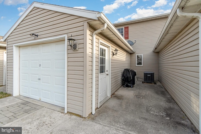 detached garage featuring central AC