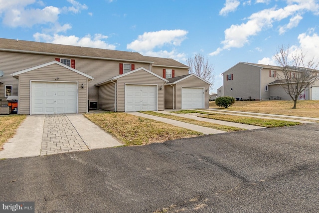 multi unit property featuring a garage