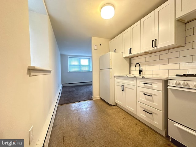 kitchen featuring tasteful backsplash, a baseboard heating unit, light countertops, white cabinets, and white appliances