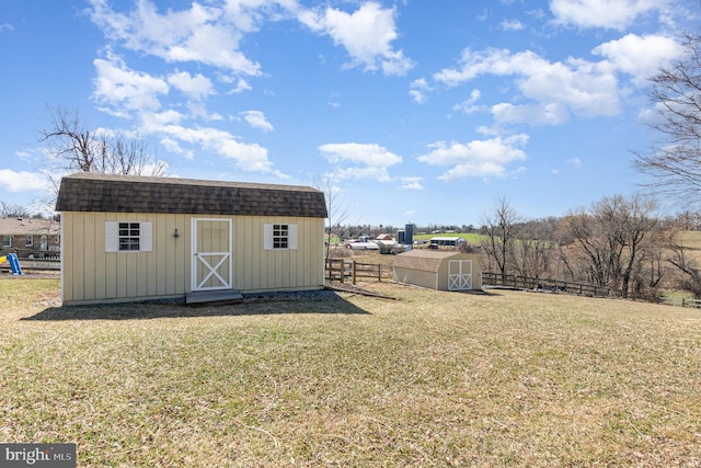 view of shed featuring fence