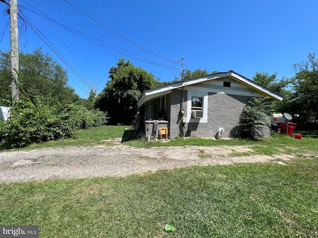 view of property exterior featuring a yard