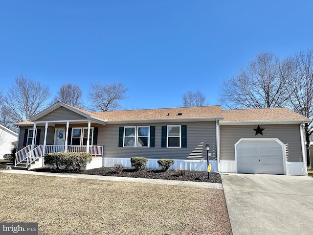 view of front of property featuring a porch, an attached garage, driveway, and roof with shingles